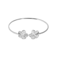 Silver bangle with floral ends on a white background - seolgold