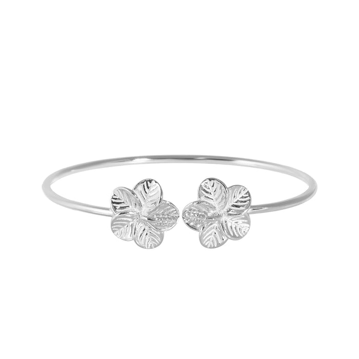 Silver bracelet with hibiscus flower designs on a white background - seolgold