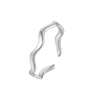 Silver ear cuff on a white background
