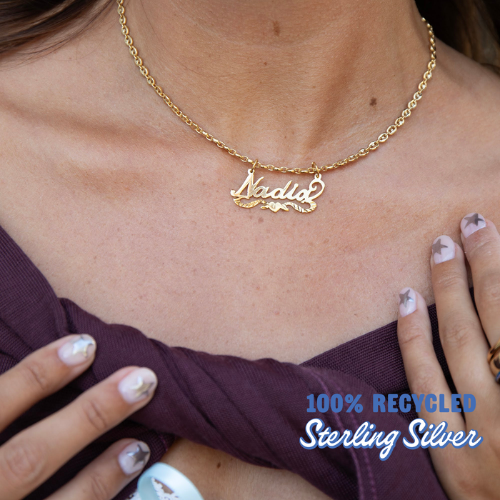 Gold necklace with 'Nadia' pendant on a person's neck, with text about recycled sterling silver.