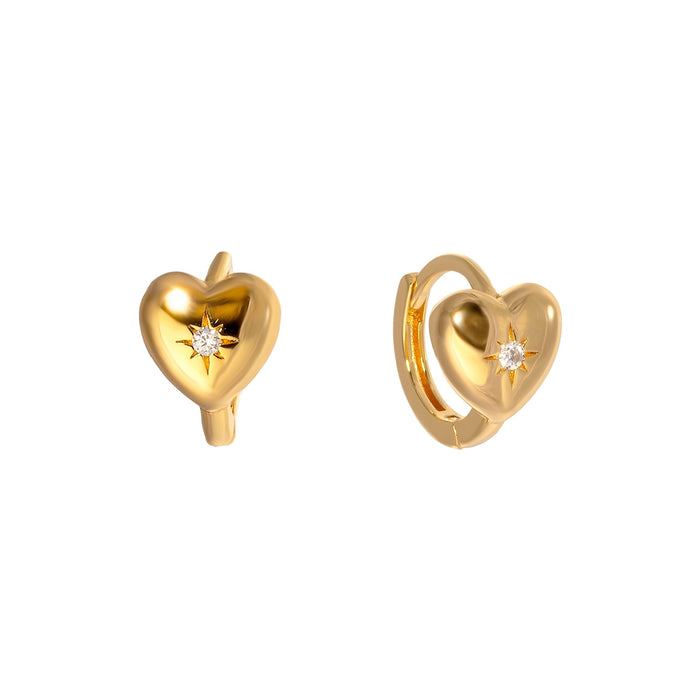 Gold heart-shaped earrings with a central diamond on a white background - seolgold