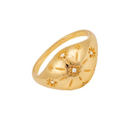 Gold ring with star designs and a central diamond on a white background - seolgold