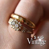 Gold ring with diamonds on a finger, branded 'S + G Vintage' - seolgold