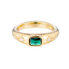 Gold ring with a green gemstone and star designs on a white background - seolgold