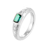 Silver ring with a green gemstone on a white background - seolgold