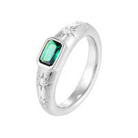Silver ring with a green gemstone on a white background - seolgold
