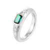 Silver ring with a green gemstone on a white background - seolgold