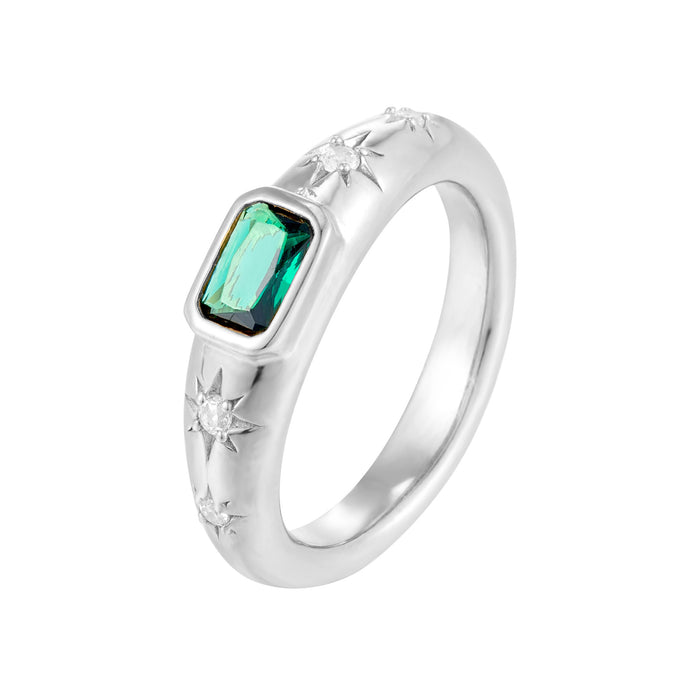 Silver ring with a green gemstone on a white background - seolgold