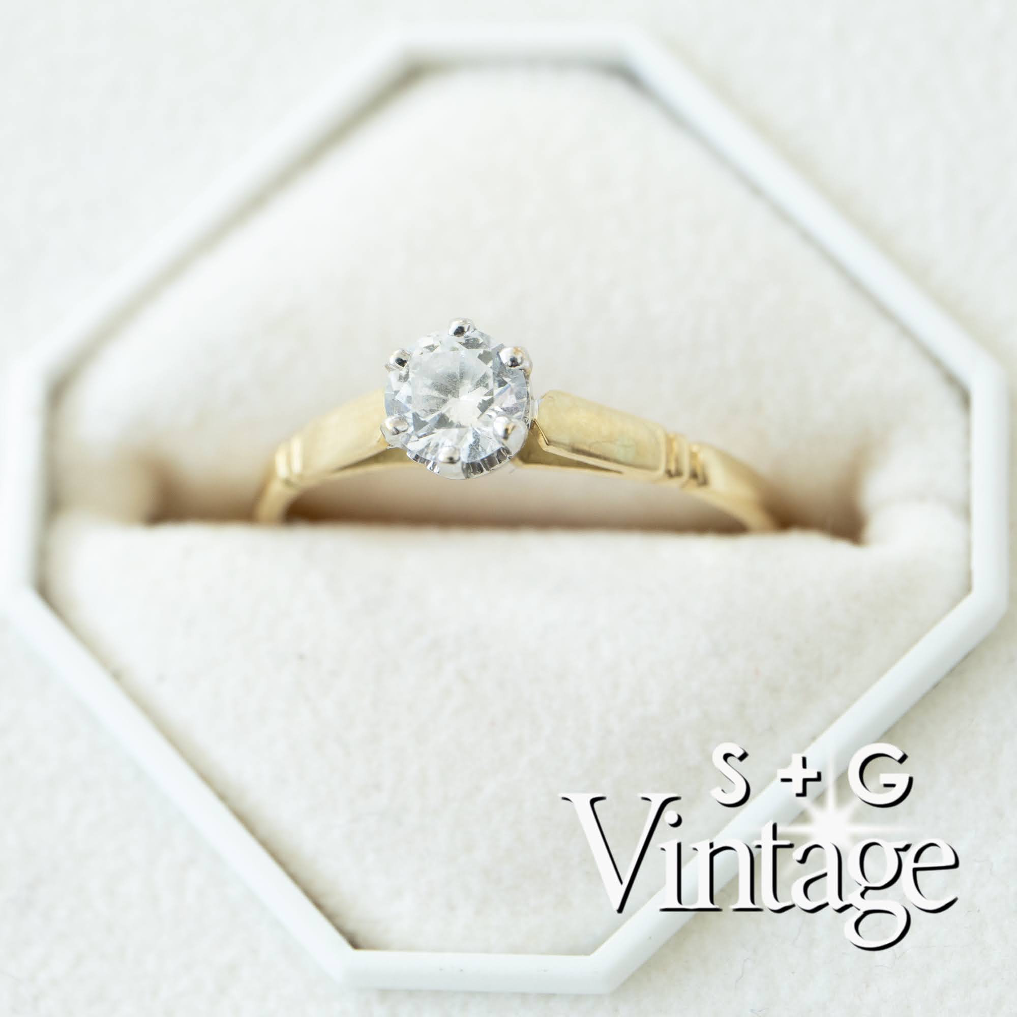 Gold ring with a diamond in a hexagonal box, featuring 'S + G Vintage' branding - seolgold