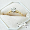 Gold ring with a diamond in a hexagonal box, featuring 'S + G Vintage' branding - seolgold