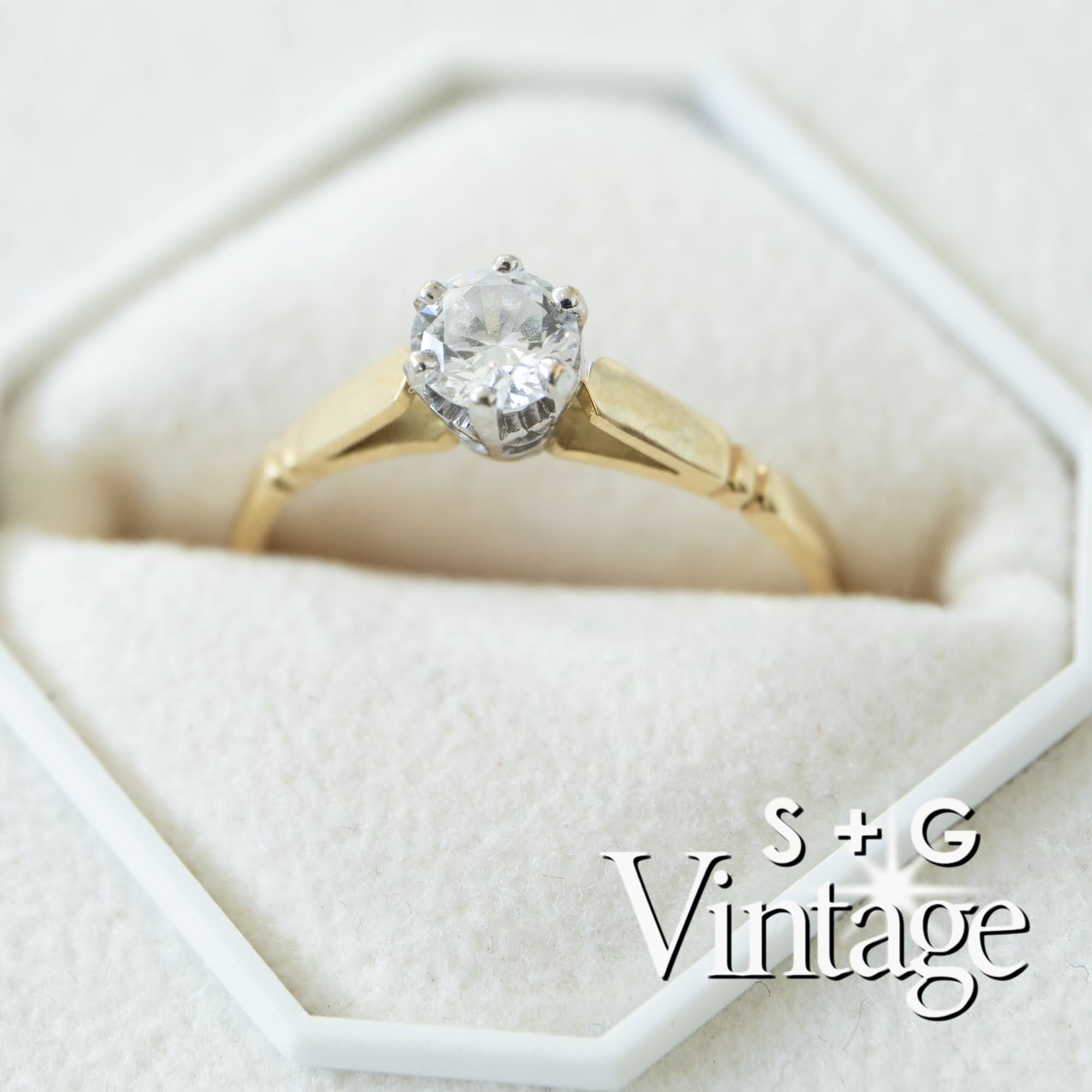 Gold ring with a diamond in a hexagonal box, featuring 'S + G Vintage' branding - seolgold