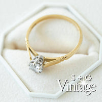 Gold ring with a diamond on a white hexagonal stand, branded 'S + G Vintage' - seolgold