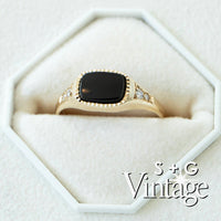 Gold ring with a black stone in a hexagonal white box, featuring 'S + G Vintage' branding - seolgold