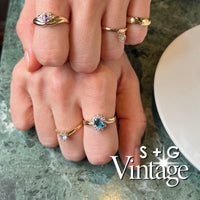 Gold ring with a diamond in a hexagonal box, featuring 'S + G Vintage' branding - seolgold