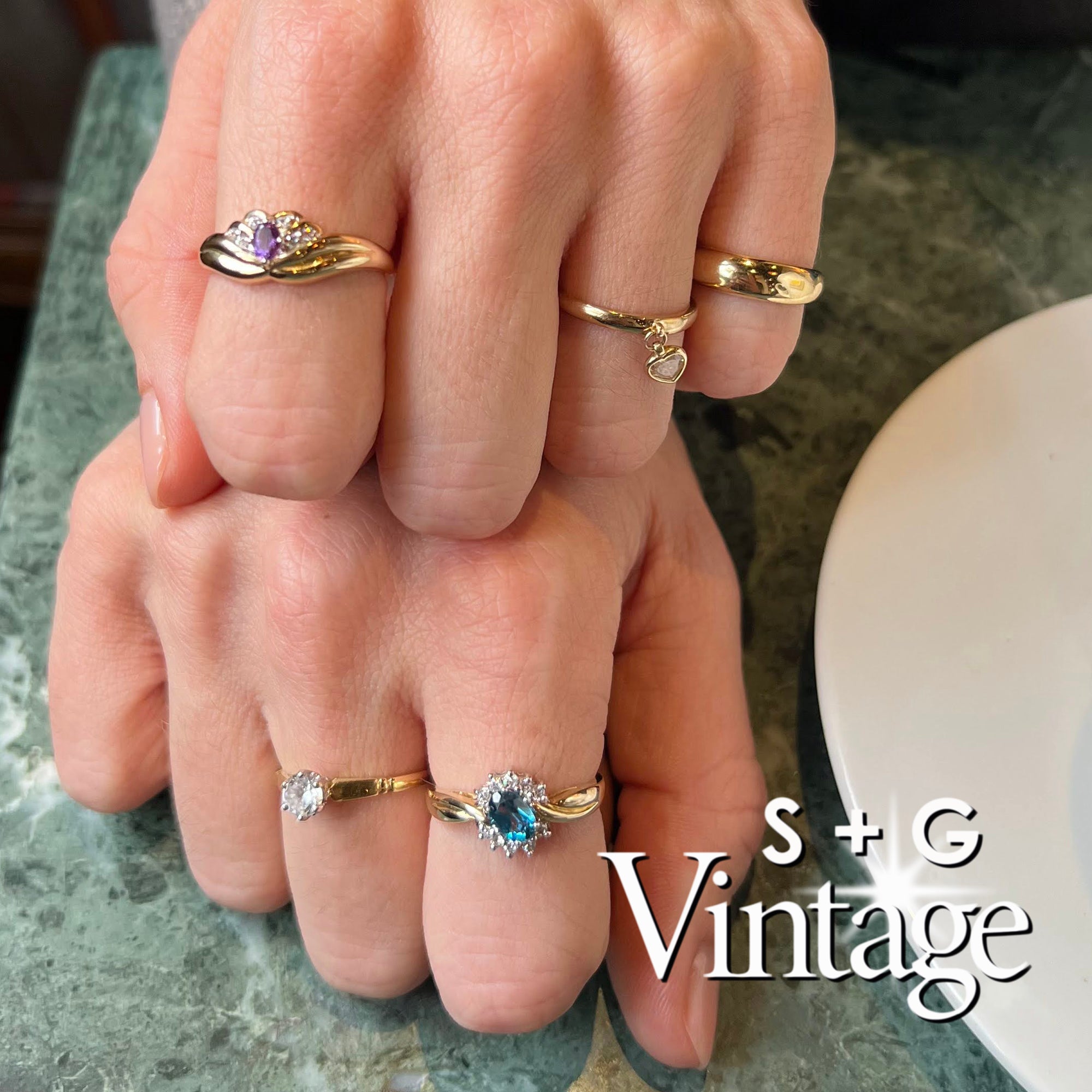 Gold ring with a diamond in a hexagonal box, featuring 'S + G Vintage' branding - seolgold