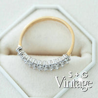 Gold ring with diamond accents on a hexagonal white stand, featuring 'S + G Vintage' branding - seolgold