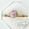Gold ring with a pink gemstone and diamond accents on a white background, branded 'S + G Vintage' - seolgold