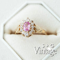 Gold ring with a pink gemstone and diamond accents on a white background, branded 'S + G Vintage' - seolgold
