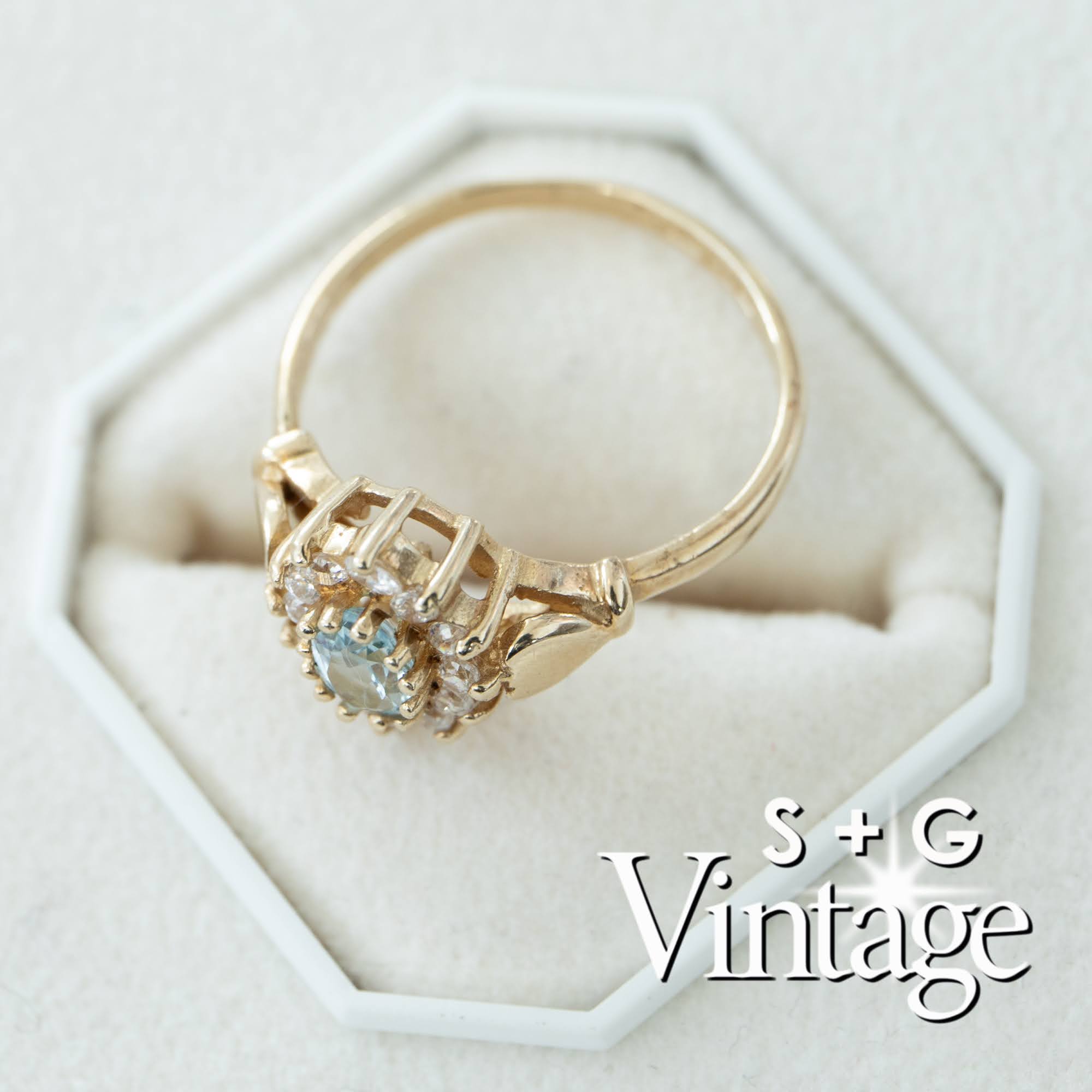 Gold ring with heart-shaped gemstone on a white hexagonal stand, branded 'S + G Vintage' - seolgold