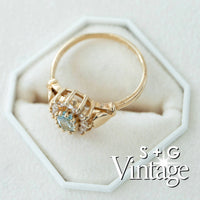 Gold ring with heart-shaped gemstone on a white hexagonal stand, branded 'S + G Vintage' - seolgold