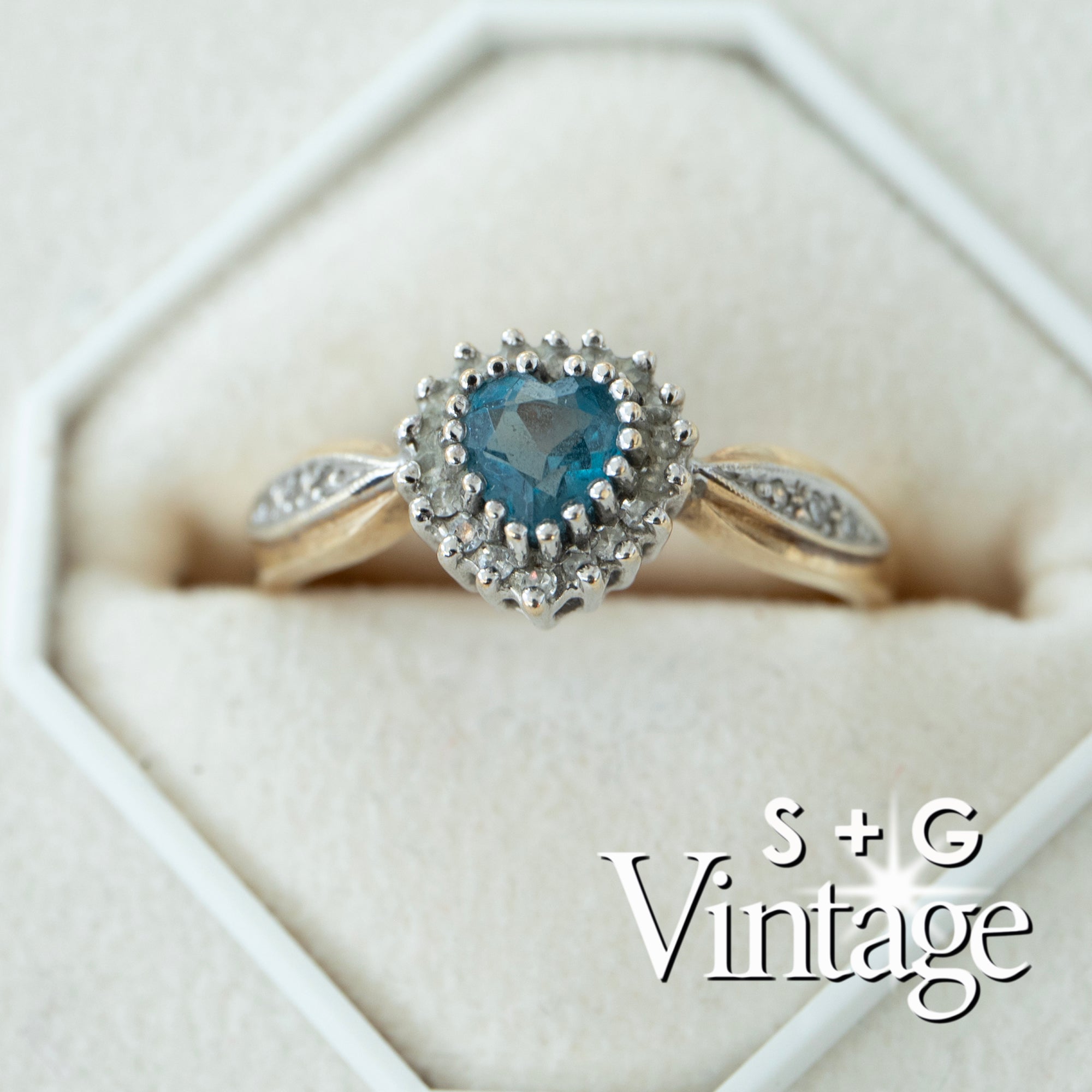 9ct gold ring with blue gemstone in a hexagonal white box, featuring 'S + G Vintage' branding - seolgold