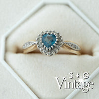 9ct gold ring with blue gemstone in a hexagonal white box, featuring 'S + G Vintage' branding - seolgold