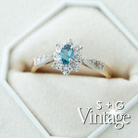 Diamond ring with blue gemstone in a hexagonal box, featuring 'S + G Vintage' branding - seolgold