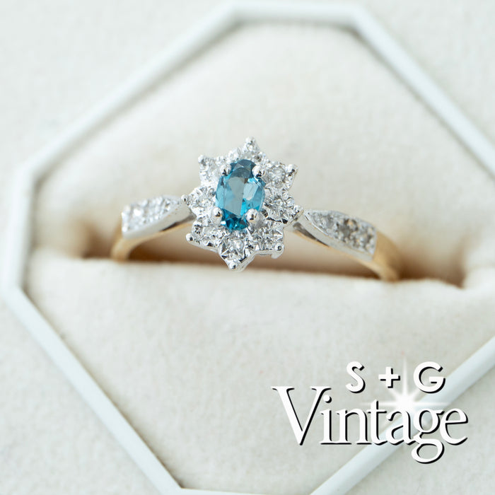 Diamond ring with blue gemstone in a hexagonal box, featuring 'S + G Vintage' branding - seolgold