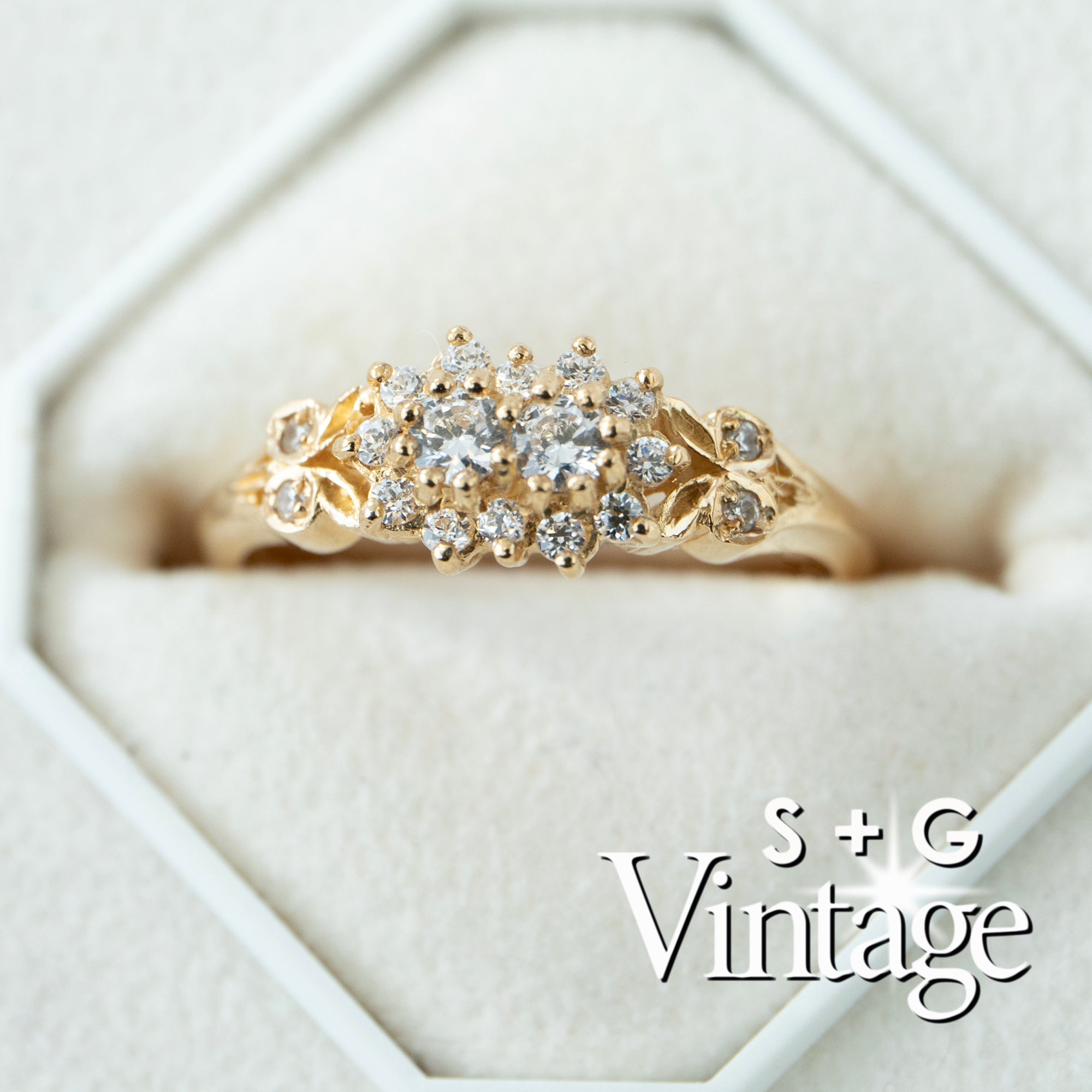 Gold ring with diamonds in a hexagonal box, featuring 'S + G Vintage' branding - seolgold