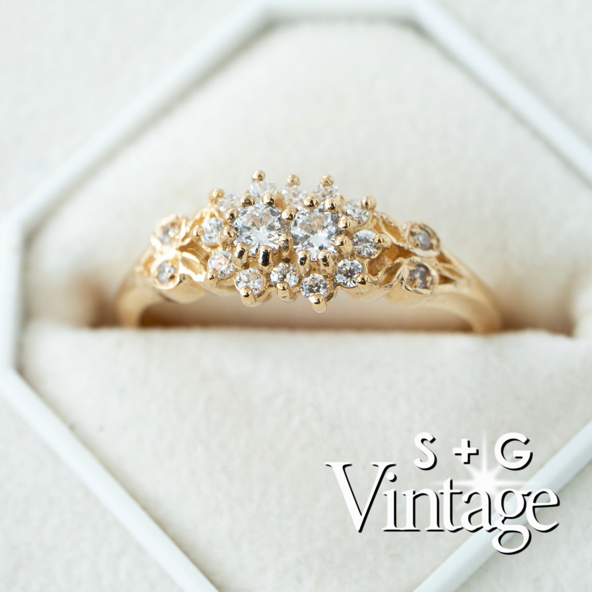 Gold ring with diamonds on a white background, featuring 'S + G Vintage' branding - seolgold