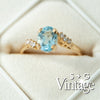 Gold ring with a blue gemstone and diamonds on a white background, featuring 'S + G Vintage' branding - seolgold