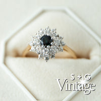Diamond ring with a black gemstone in a hexagonal box, featuring 'S + G Vintage' branding - seolgold