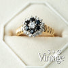 Gold ring with black gemstone and diamonds on a white background, featuring 'S + G Vintage' branding - seolgold