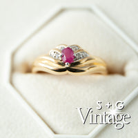 Gold ring with a red gemstone and diamonds in a hexagonal box, branded 'S + G Vintage' - seolgold