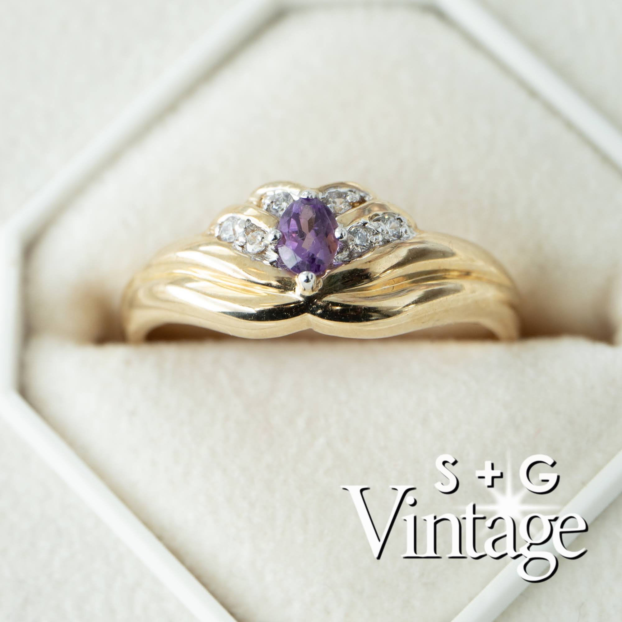 Gold ring with a purple gemstone and diamonds in a box, branded 'S + G Vintage' - seolgold
