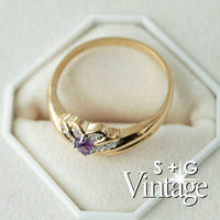 Gold ring with purple gemstone on a white hexagonal cushion, branded 'S + G Vintage' - seolgold