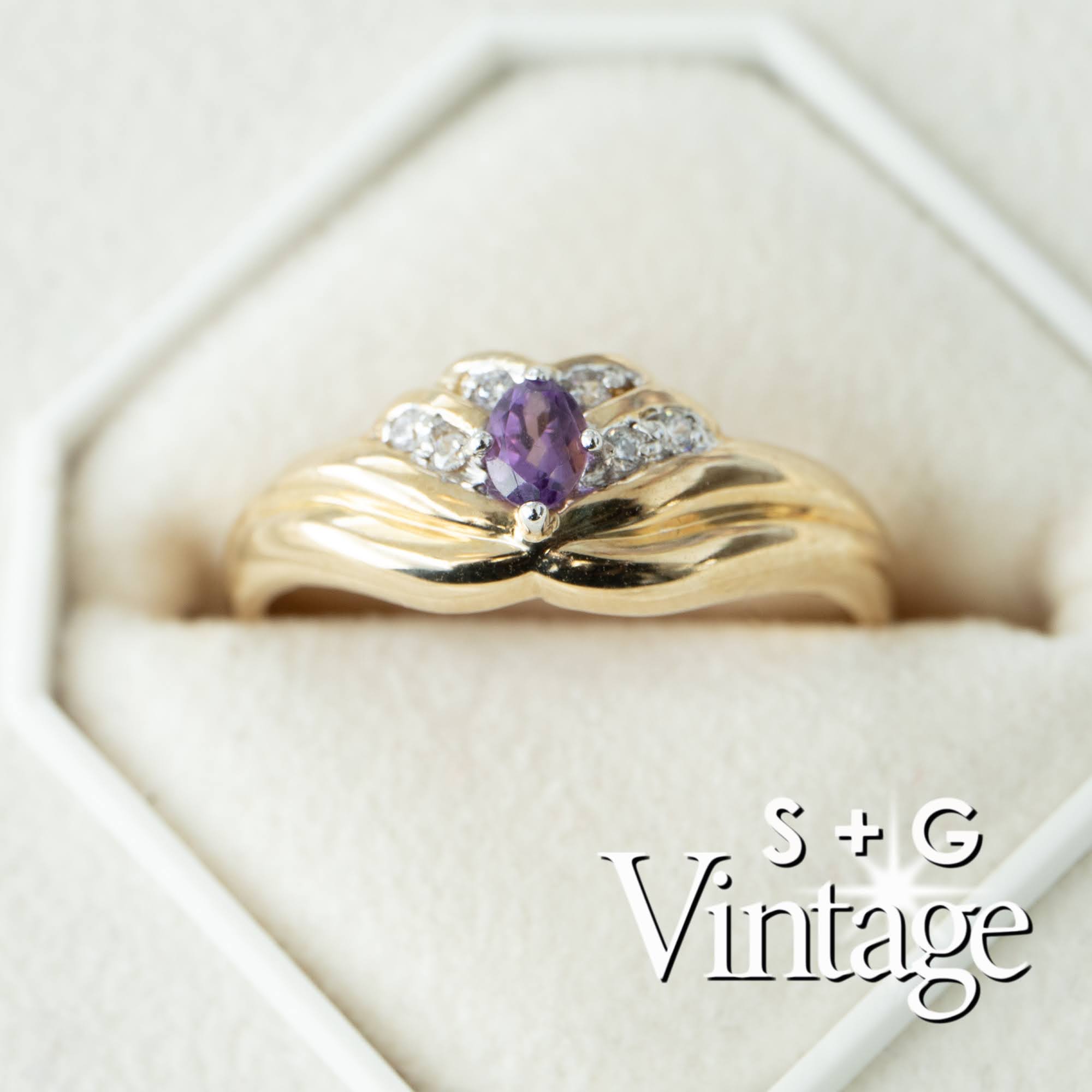 Gold ring with a purple gemstone in a hexagonal box, branded 'S + G Vintage' - seolgold