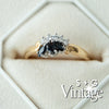 Gold ring with black gemstone and diamonds in a hexagonal box, featuring 'S + G Vintage' branding - seolgold