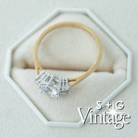Gold ring with a diamond on a white hexagonal stand, featuring 'S + G Vintage' branding - seolgold