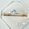 Diamond ring with gold band on a white hexagonal stone, featuring 'S + G Vintage' branding - seolgold