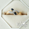 Gold ring with black and clear gemstones in a hexagonal box, featuring 'S + G Vintage' branding - seolgold