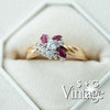 Gold ring with red gemstones and diamonds in a hexagonal box, branded 'S + G Vintage' - seolgold