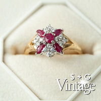 Gold ring with red gemstones and diamonds in a hexagonal box, featuring 'S + G Vintage' branding - seolgold