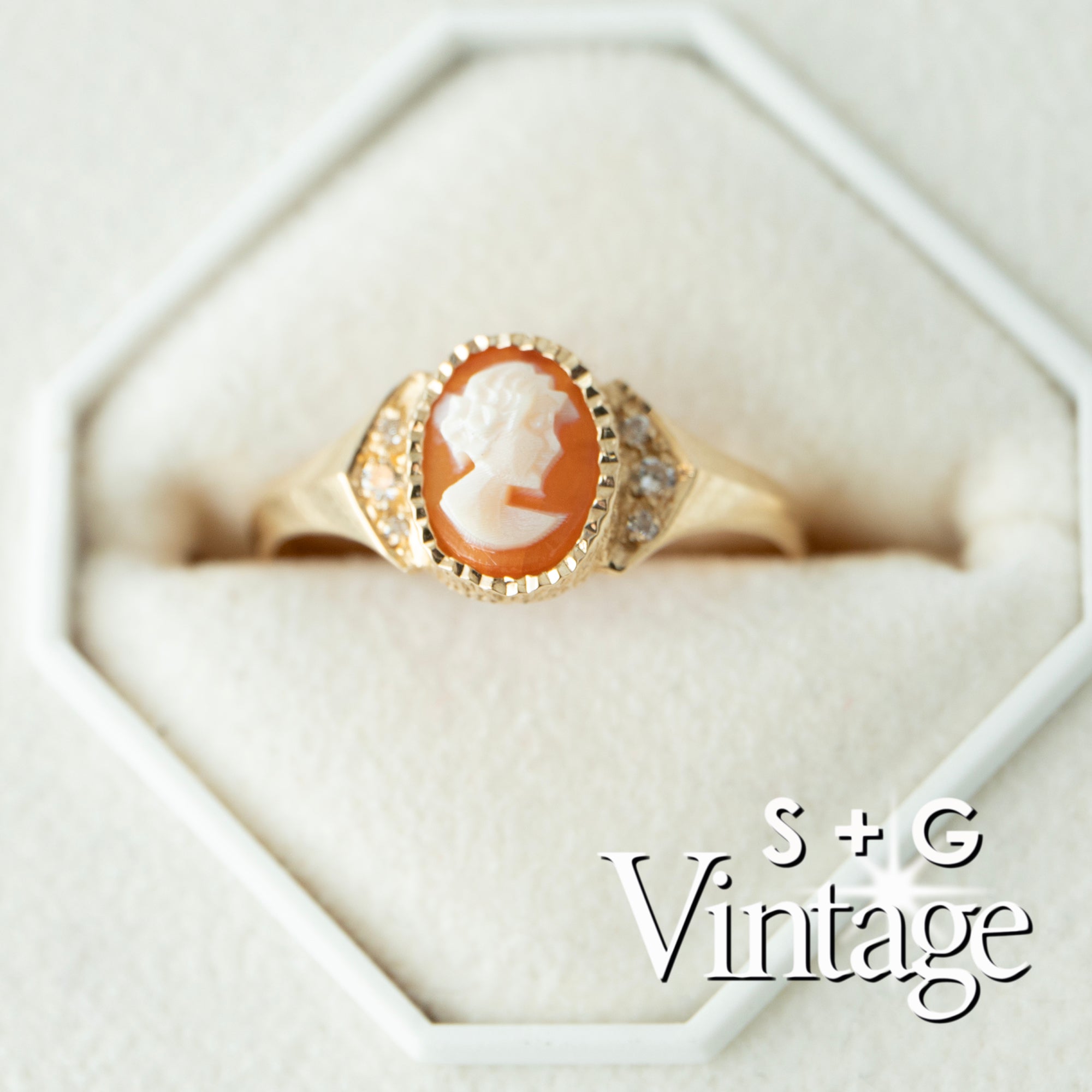 Vintage-style gold ring with a cameo design on a white background, featuring the brand 'S + G Vintage' - seolgold