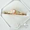 Vintage-style gold ring with a cameo center stone on a white background, featuring 'S + G Vintage' branding - seolgold