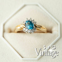 Gold ring with a blue gemstone in a hexagonal box, branded 'S + G Vintage' - seolgold
