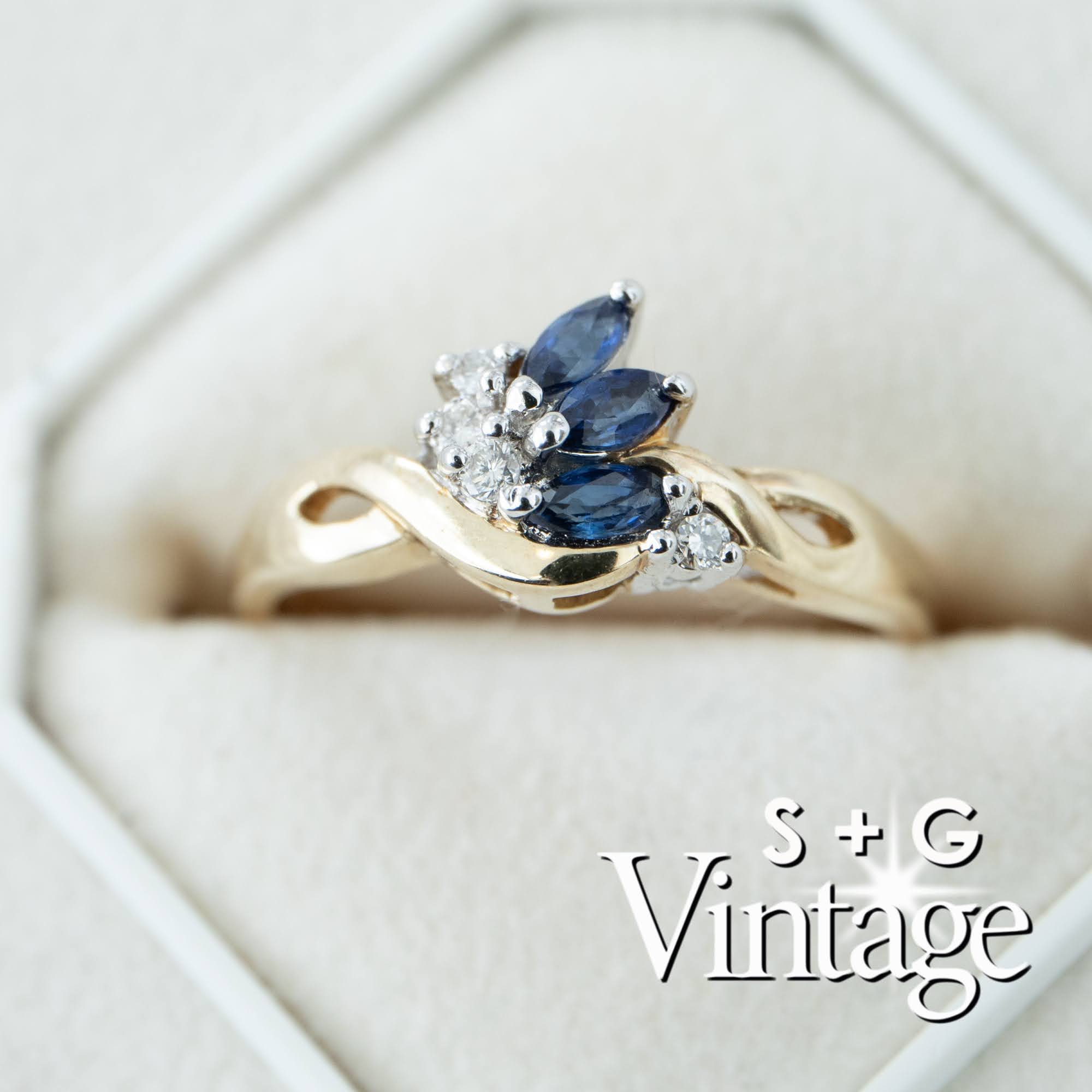 Gold ring with blue gemstones and diamonds on a white background, featuring 'S + G Vintage' branding - seolgold