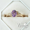 Gold ring with a purple gemstone and small diamonds in a hexagonal box, branded 'S + G Vintage' - seolgold